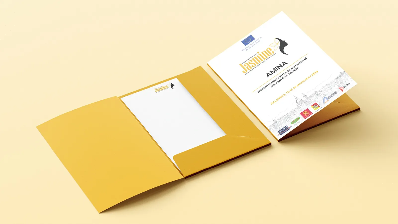 A yellow presentation folder and an AMINA invitation card with the Jasmine logo