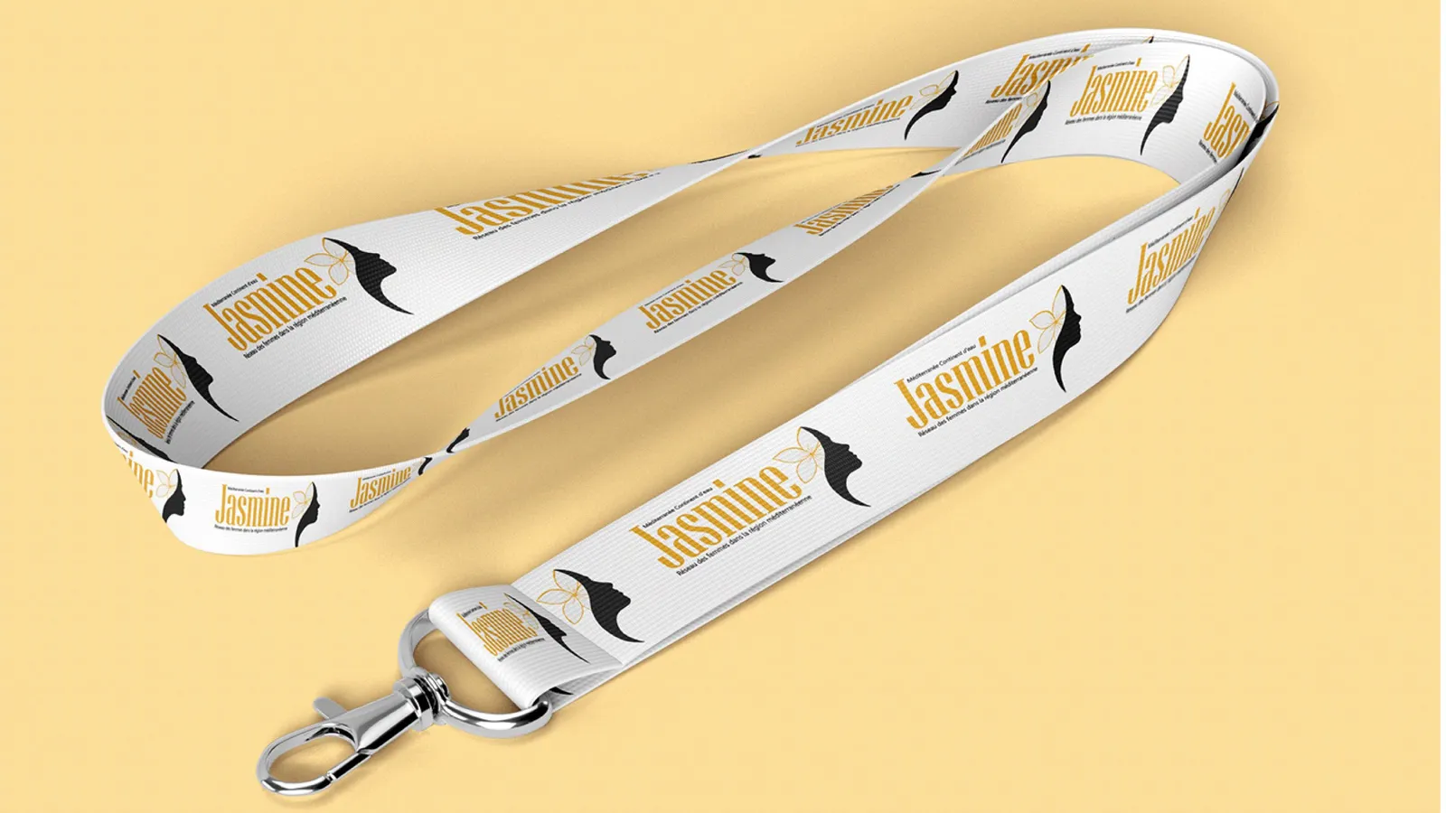 A white lanyard printed with the Jasmine logo